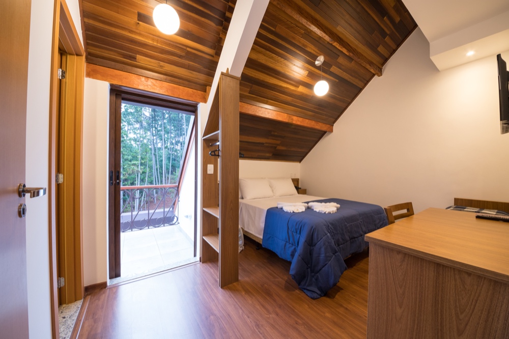 Quarto do Apartamento Deluxe visto da varanda